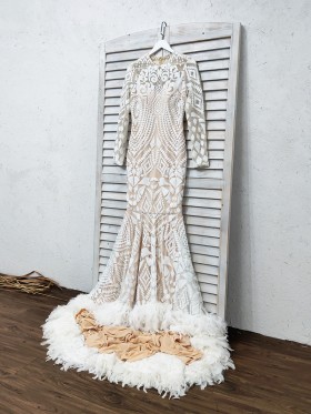 white sequin long sleeve prom dress with feather hemline white sequin long sleeve prom dress with feather hemline