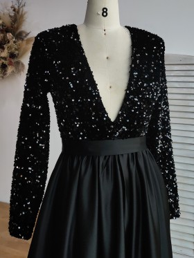 black sequin top with plunging V neckline and long sleeves black sequin top with plunging V neckline and long sleeves