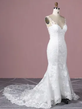 white lace mermaid wedding dress with a chapel train