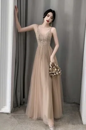 luxury pearled plunging neck nude tulle prom dress
