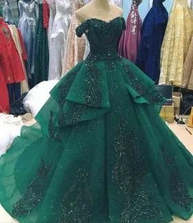 off the shoulder sparkly emerald ruffled prom ball gown
