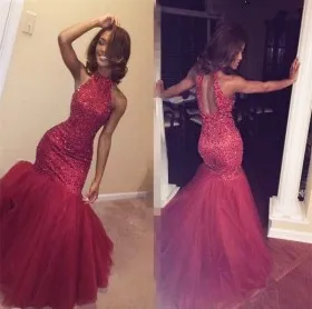 Heavily diamonds embellished cherry red tulle trumpet unique prom gown