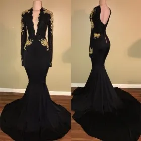Gold lace appliqued black long sleeve plunging V neckline formal dress