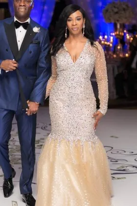 Heavily beaded champagne long sleeve formal dress