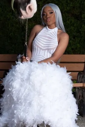 white sequin feather drop waist trumpet prom gown