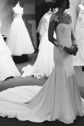 Unique and elegant lace appliqued sheer long sleeve mermaid wedding dress