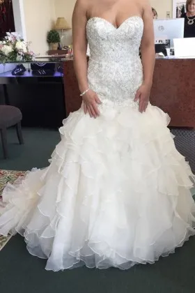 Pearl beaded ivory satin and ruffled organza classic wedding gown