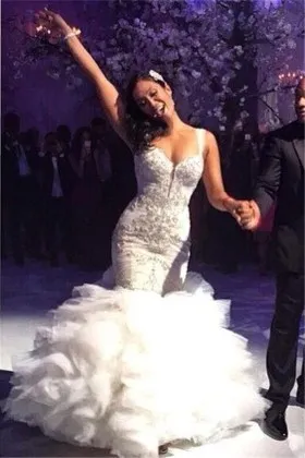 Beaded body hugging ruffled trumpet wedding dress