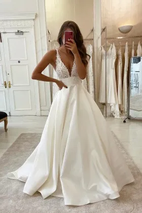 ivory lace and satin plunging V neck wedding dress