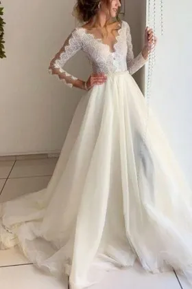 scalloped lace and tulle sleeved ivory wedding gown