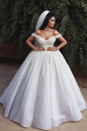 mini flowers and pearls adorned satin wedding gown
