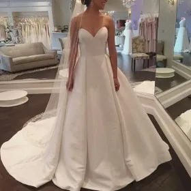 strapless sweetheart ivory satin wedding ball gown