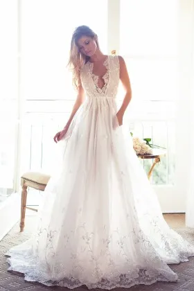 Scalloped lace plunging neckline sheer wedding gown