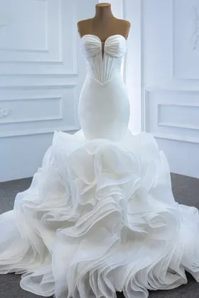 cascading ruffled white organza corset bridal gown