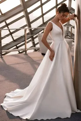 plunging neckline ivory satin a line simple wedding gown