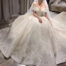 sparkling wave sequinned lace off shoulder wedding dress
