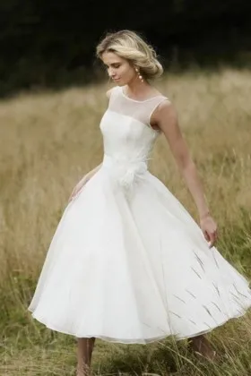 Ivory tea length outdoor bridal dress sleeveless illusion neckline