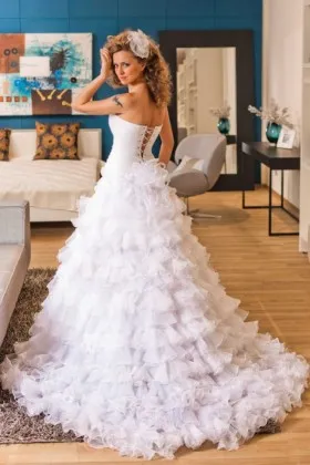 Whimsical ruffled white organza wedding dress