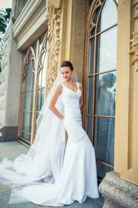 Elegant white spandex mermaid long bridal gown with wide straps and court train