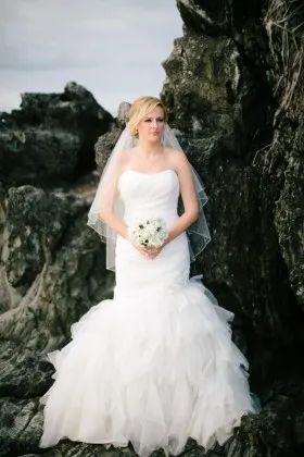 Timeless ivory ruched tulle strapless trumpet ruffled beaded wedding dress