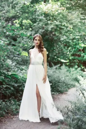 plunging V neckline spaghetti straps ivory satin and chiffon split bridal gown