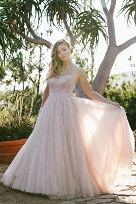 Dramatic blush lace and tulle strapless sweetheart wedding dress