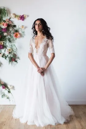 Jagged plunging V neckline lace with puffy tulle whimsical wedding dress