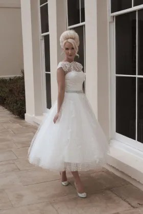 Polka dot tulle and lace tea length illusion cap sleeve wedding gown