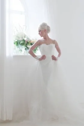 Sleek satin column long sleeve wedding dress with detachable tulle overskirt