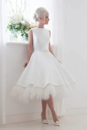 Unique tea length satin wedding dress with ostrich feather trim
