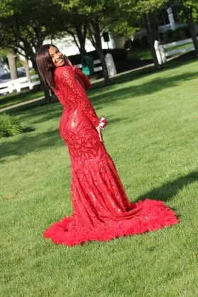 red sequin and feather prom dress